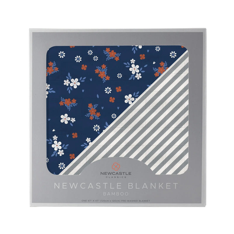 Serenity and Finley Stripe Bamboo Muslin Blanket in packaging with blue floral and striped design.