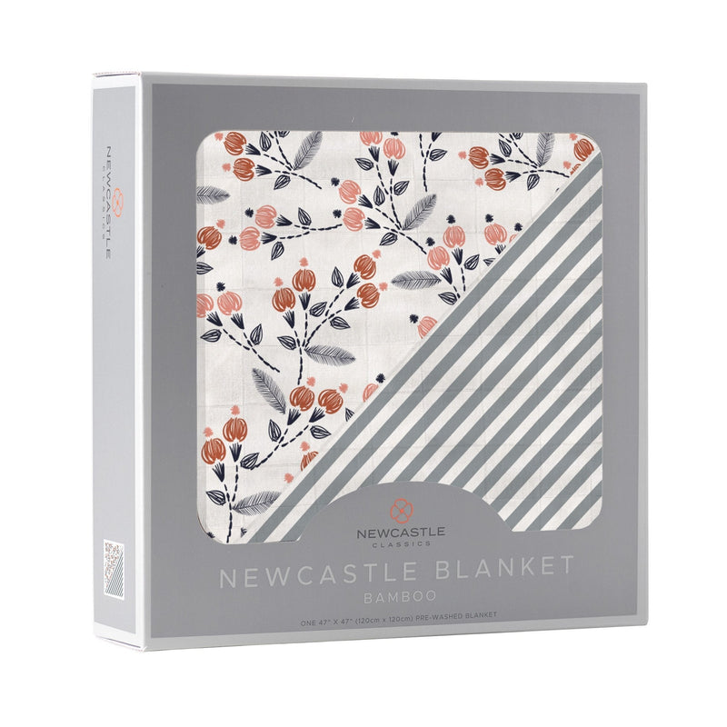 Dahlia Floral and Finley Stripe bamboo muslin blanket in packaging.