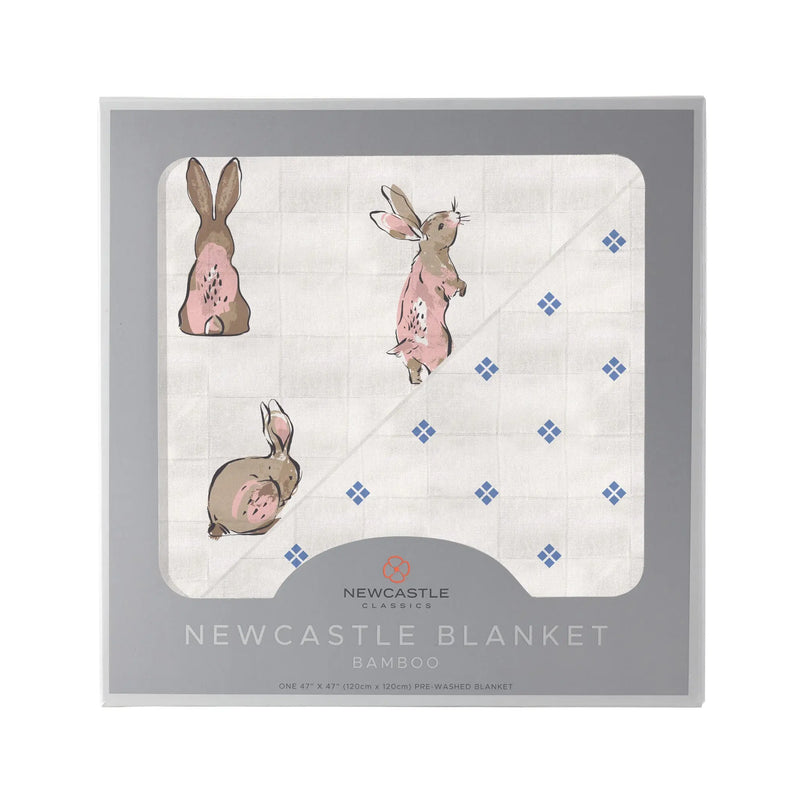 Powder Pink Bunnies and Periwinkle Diamond Polka Dot Bamboo Newcastle Blanket in a box.