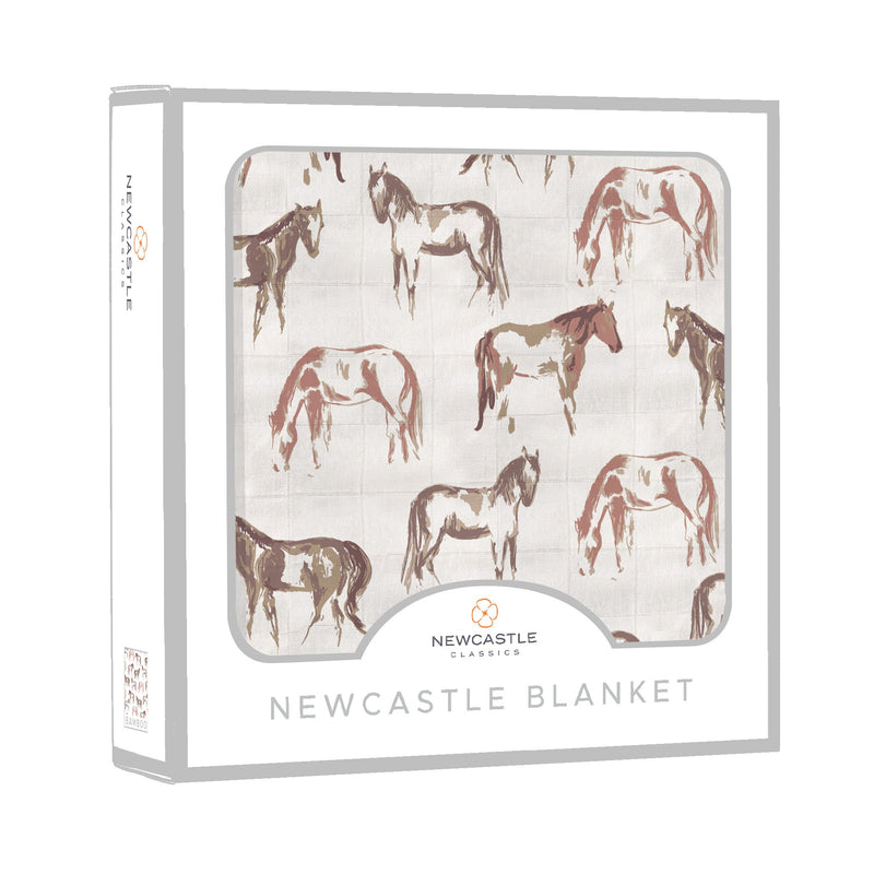 Wild Horses Bamboo muslin blanket in package displaying horse pattern.