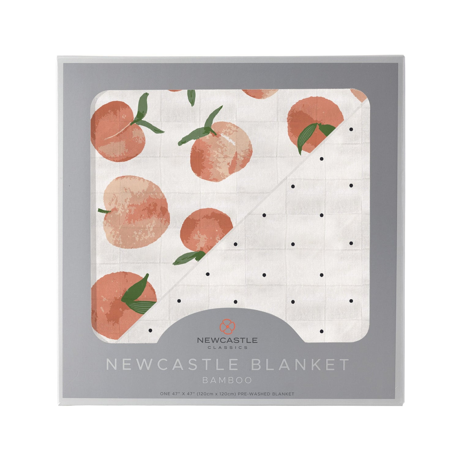 Bamboo muslin blanket with carnelian peaches print on one side and black and white polka dots on the other