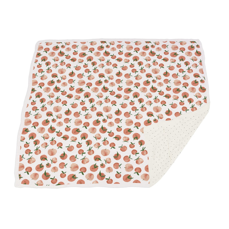 Carnelian Peaches bamboo muslin blanket with polka dot design, 47x47 inches.