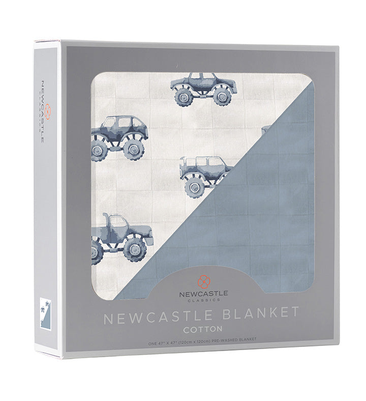 Indigo Monster Trucks and Blue Fog Cotton Newcastle Blanket in packaging.