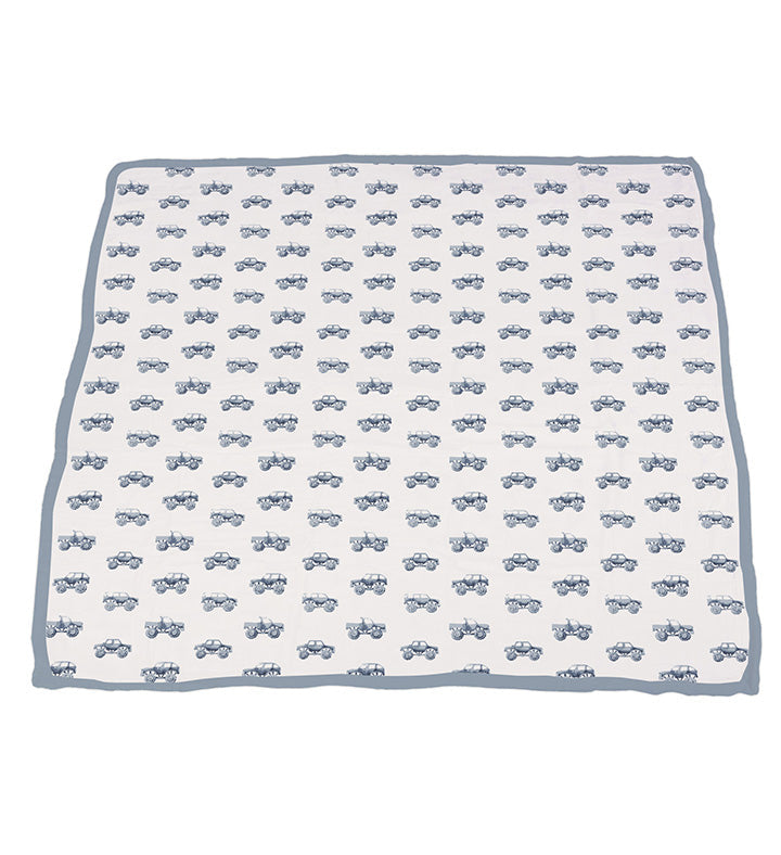 Indigo monster trucks pattern on cotton muslin blanket, 47x47 inches.