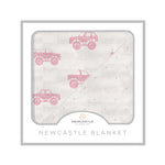 Bamboo muslin blanket with pink monster trucks print and a pink polka dot reverse side