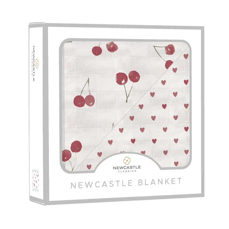 Two Hearts and Sweetheart Cherry design on bamboo muslin blanket in Newcastle Classics packaging.