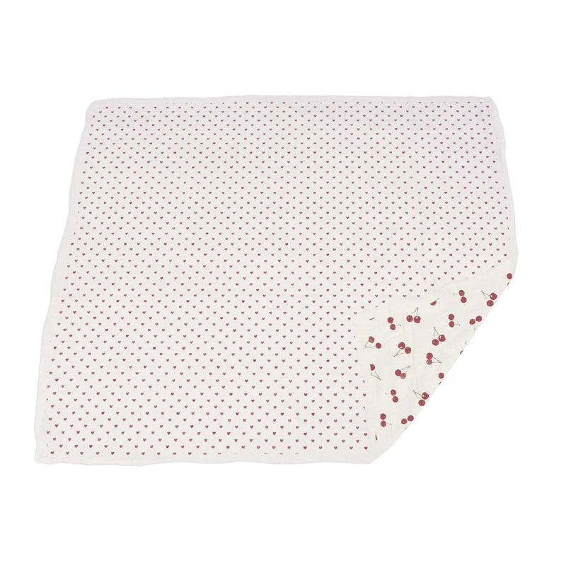 Two Hearts and Sweetheart Cherry Newcastle Blanket made of natural bamboo muslin with cherry pattern.