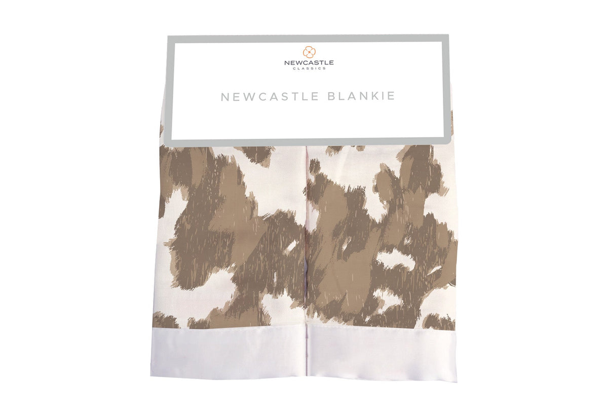 Small square security blanket with a Yellowstone-style cowhide print in brown and cream