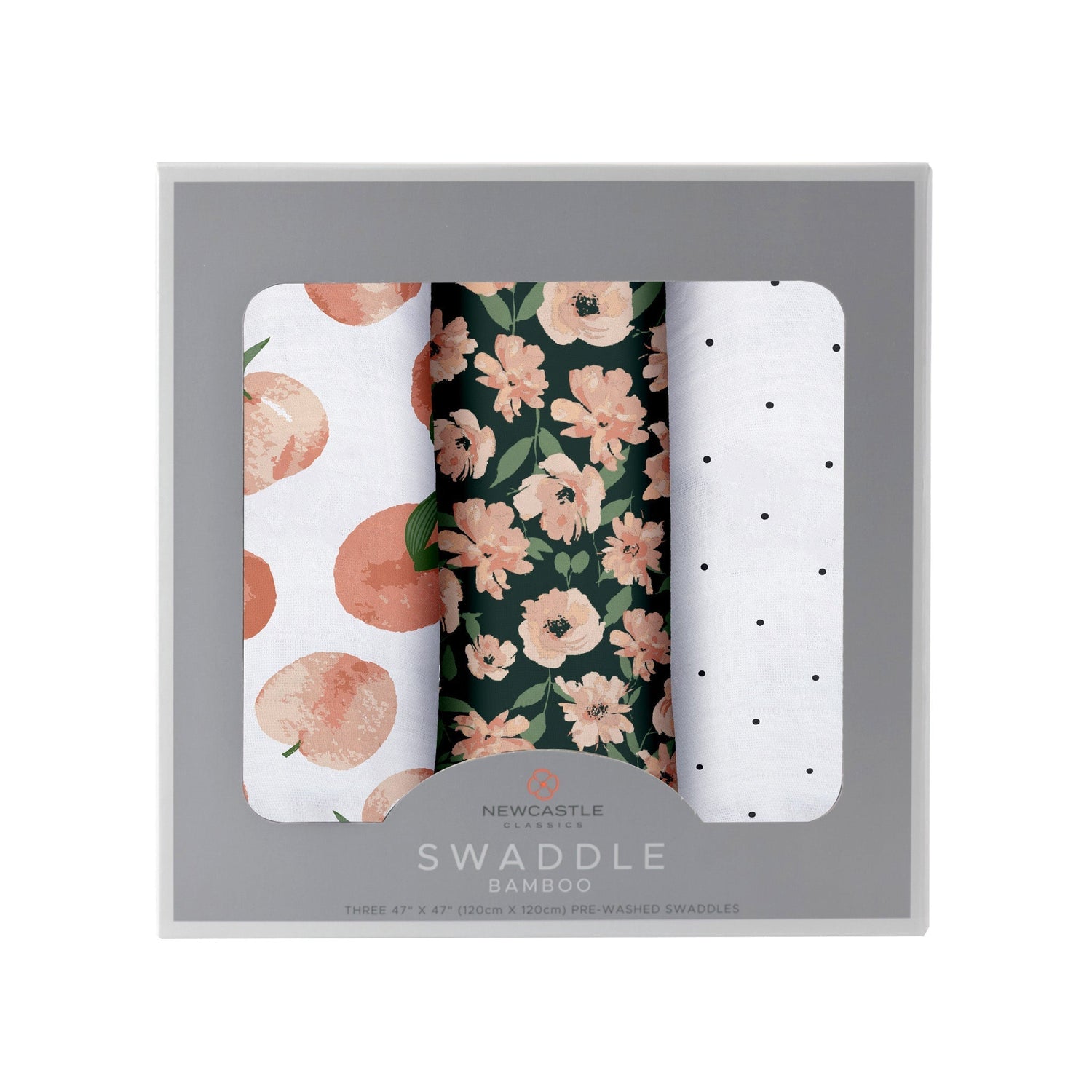 Three folded bamboo muslin swaddle blankets in warm sunset pink and orange polka dot tones