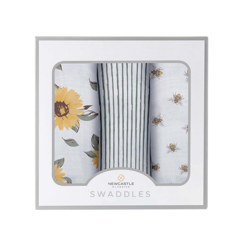 Sunrise to Sunset Swaddle 3 Pack in natural bamboo muslin with sunflower and bee patterns.