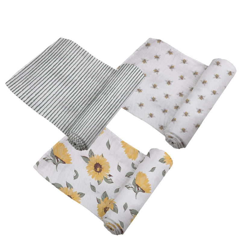 Three "Sunrise to Sunset" swaddles with varying patterns, made from breathable bamboo muslin.