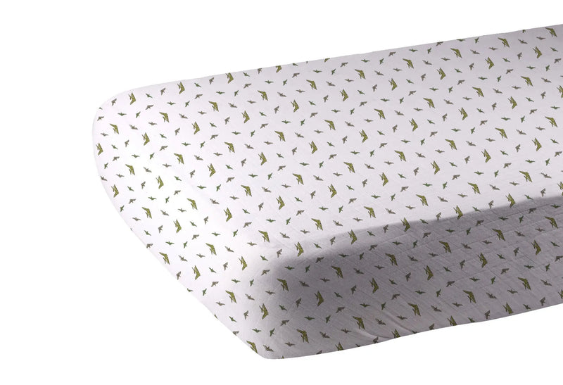 Pteranodon Cotton Muslin Crib Sheet with dinosaur print on standard crib mattress.