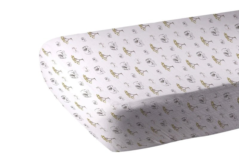Bamboo muslin crib sheet with rhinos and elephants print, soft and breathable.