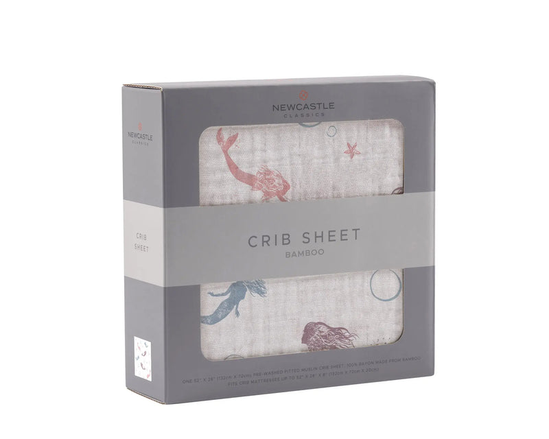 Mermaids Bamboo Muslin Crib Sheet in packaging, breathable and soft for year-round comfort.