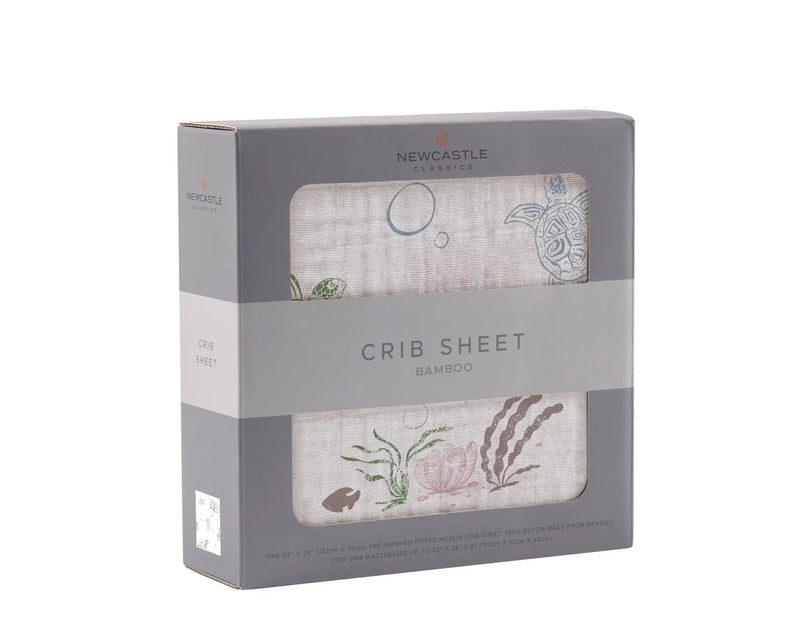 Turtles Bamboo Muslin Crib Sheet in packaging, featuring soft and breathable material for standard crib mattresses.