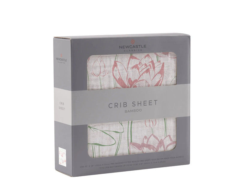 Water Lily Bamboo Muslin Crib Sheet in packaging, soft and breathable, tailored to fit standard crib mattresses.