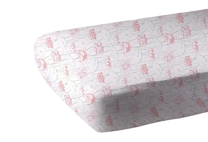Water Lily Bamboo Muslin Crib Sheet with pink floral design.