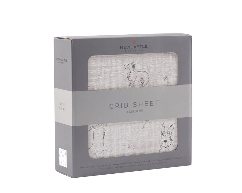 Corgi Bamboo Muslin Crib Sheet in packaging with corgi illustrations.