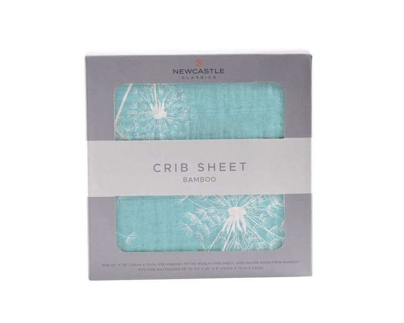 Dandelion Seeds Bamboo Muslin Crib Sheet in packaging.