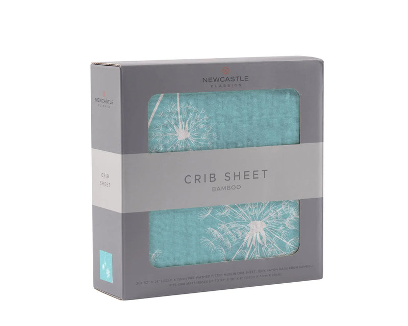 Dandelion Seeds Bamboo Muslin Crib Sheet in packaging with soft breathable design.