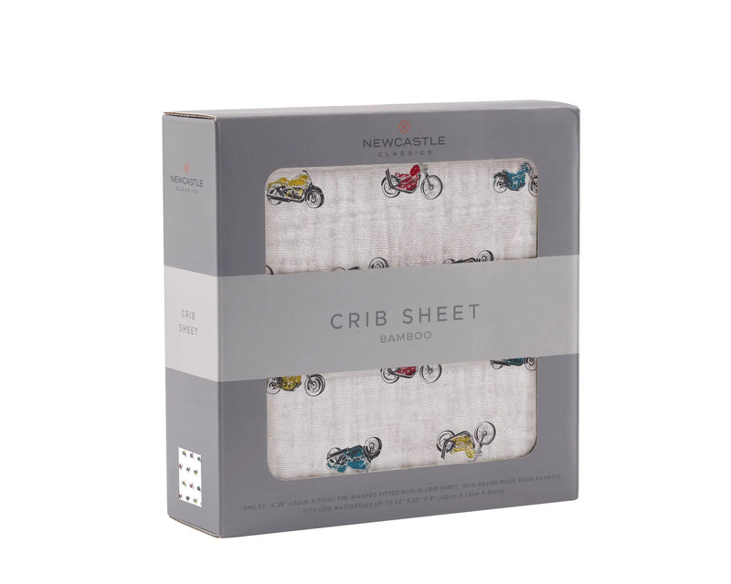 Vintage motorcycles bamboo muslin crib sheet in packaging.