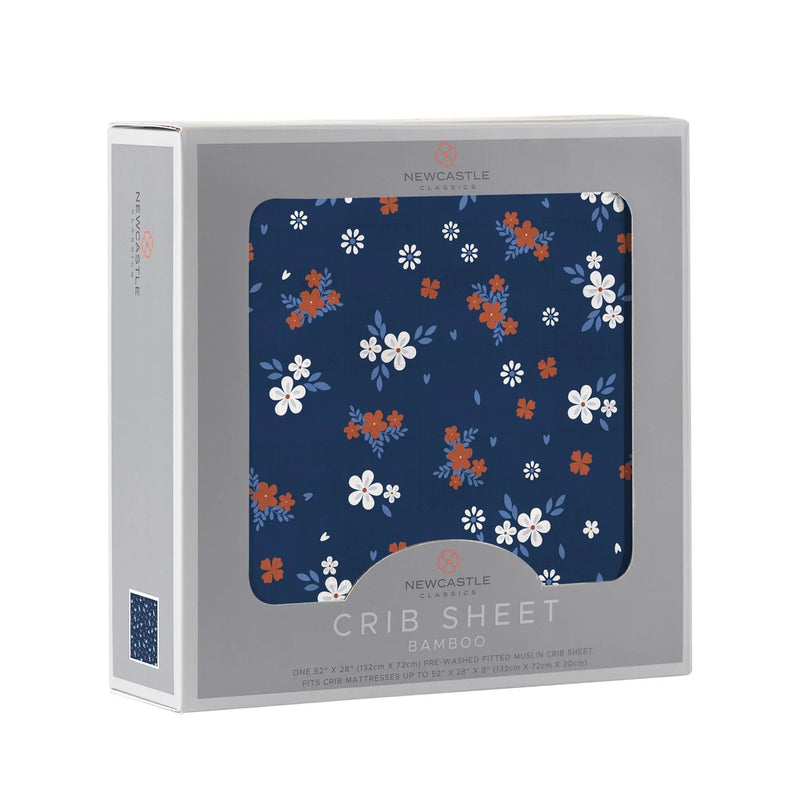 Serenity Floral Bamboo crib sheet in packaging with floral pattern, made from 100% natural bamboo muslin.