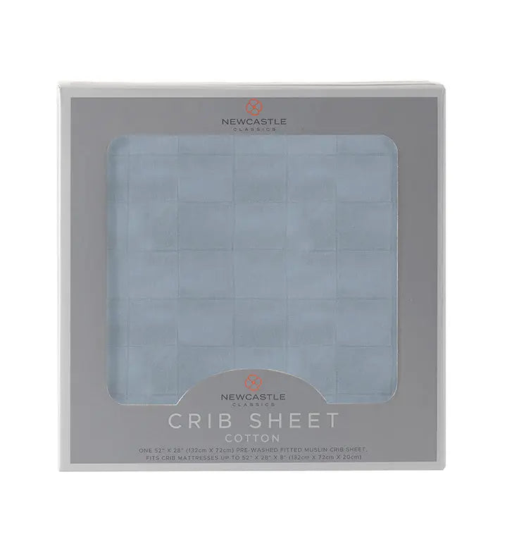 Blue Fog Newcastle Cotton Crib Sheet in packaging, 100% natural cotton muslin, fits standard crib mattress.