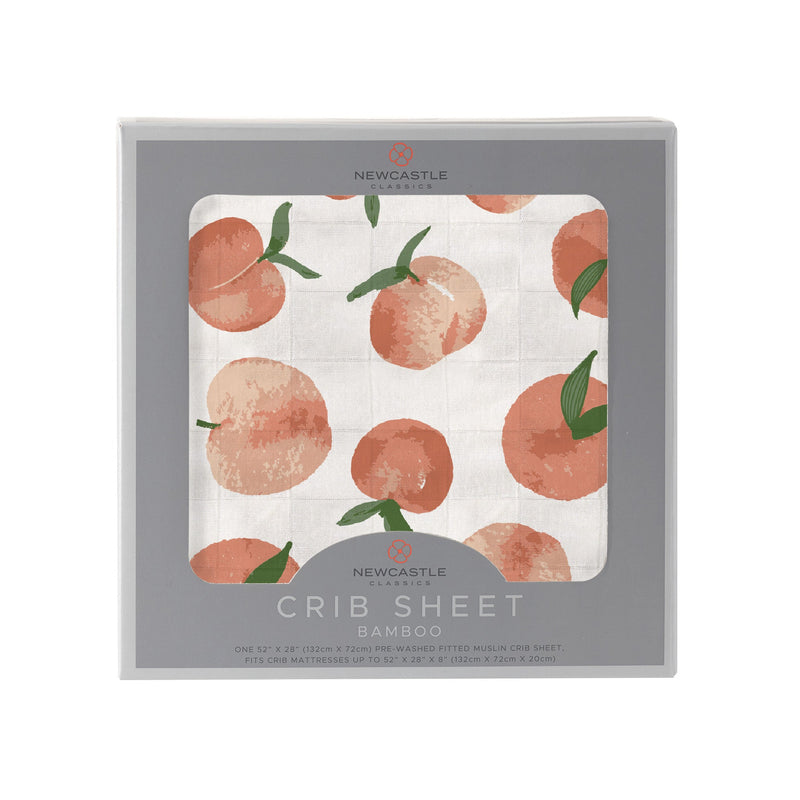 Carnelian Peaches Crib Sheet with peach pattern in natural bamboo muslin.