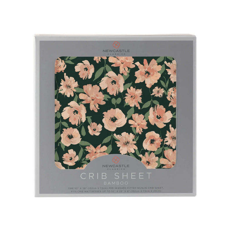 Canyon Sunset Flowers Bamboo Crib Sheet in packaging with floral pattern.