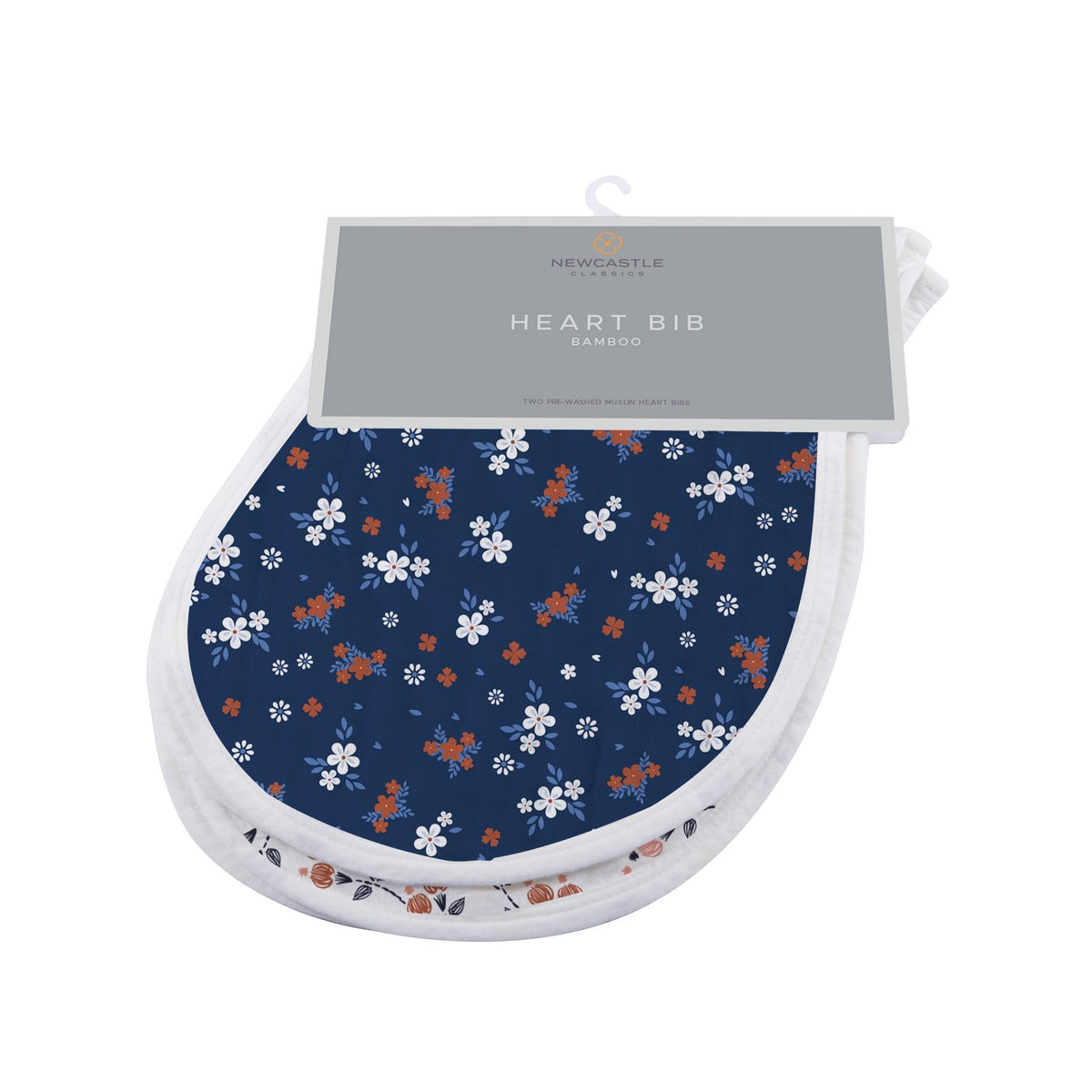 Two heart-shaped baby bibs in a floral print with snap closures at the neck