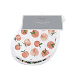 Two heart-shaped baby bibs in a warm Canyon Sunset print with snap closures at the neck