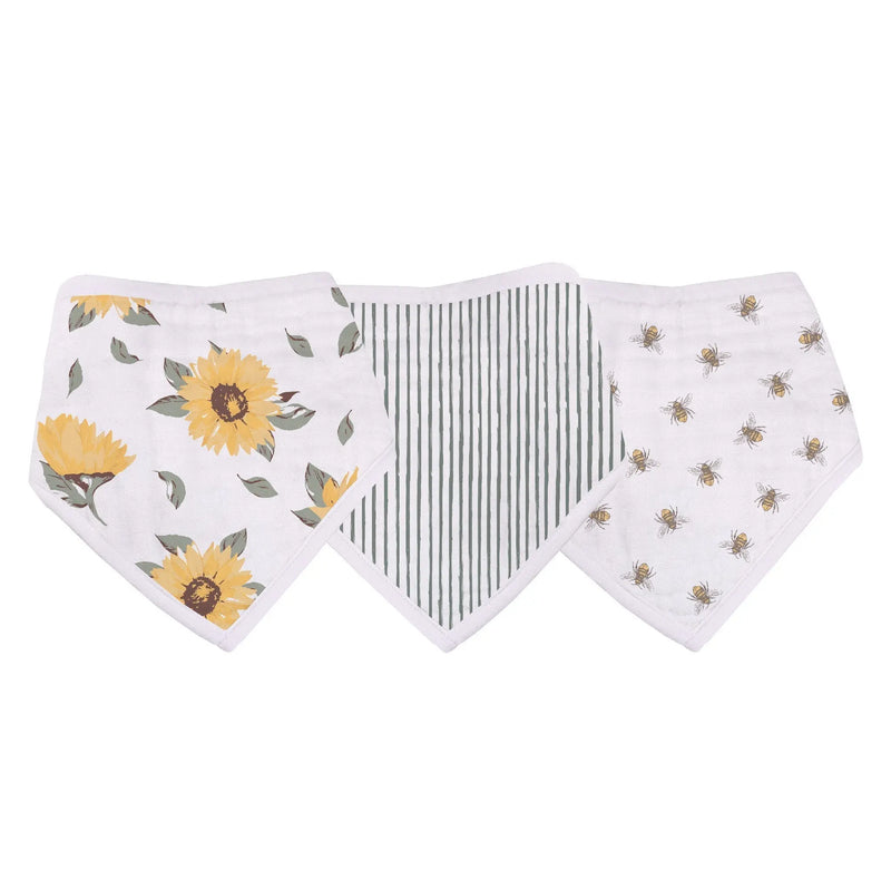 Sunrise to Sunset Bandana Bibs with floral, striped, and bee patterns made from bamboo muslin.