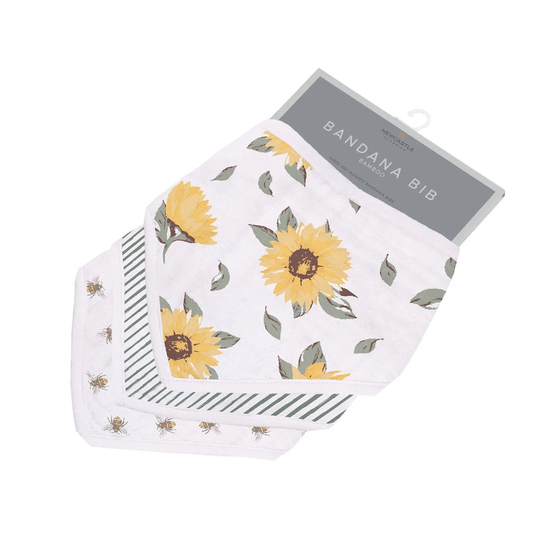 Sunrise to Sunset Bandana Bibs with sunflower pattern made from soft bamboo muslin, featuring absorbent fabric and snap closures.
