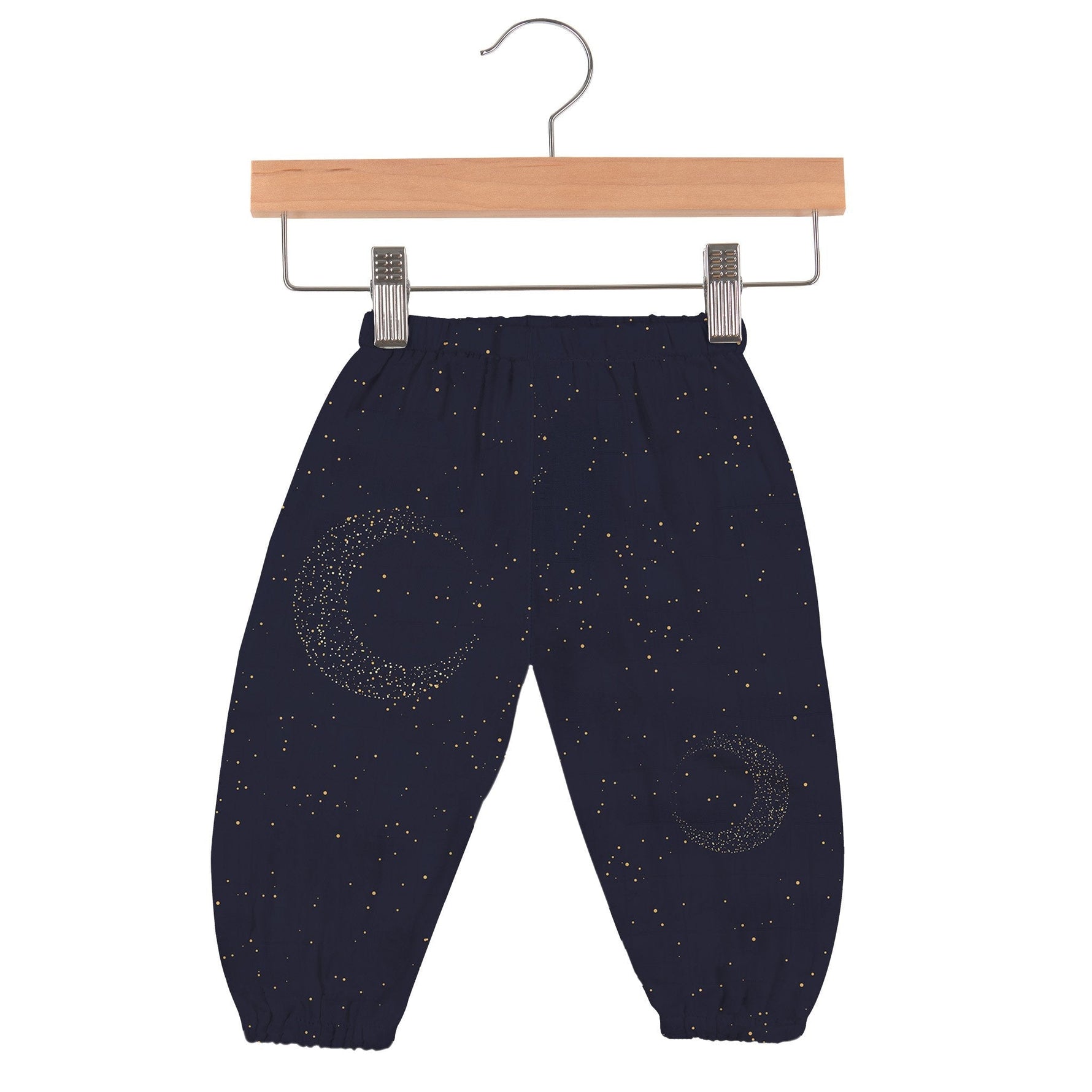 Baby pants in dark midnight blue with a moon and star pattern and an elastic waistband