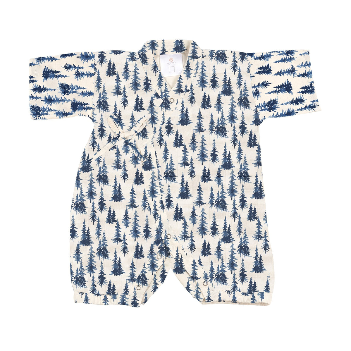 Kimono-style baby jumpsuit in indigo blue woodland print with wrap snap closure and snap leg openings