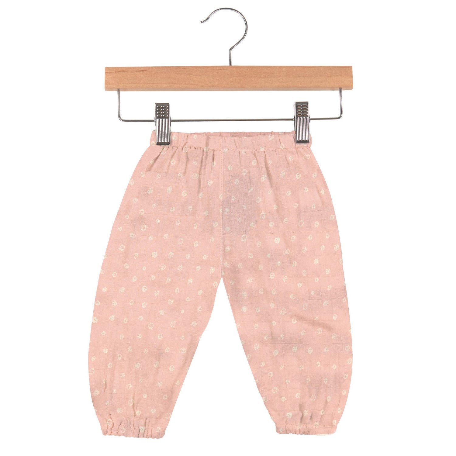 Baby pants in pink with white polka dot pattern and an elastic waistband