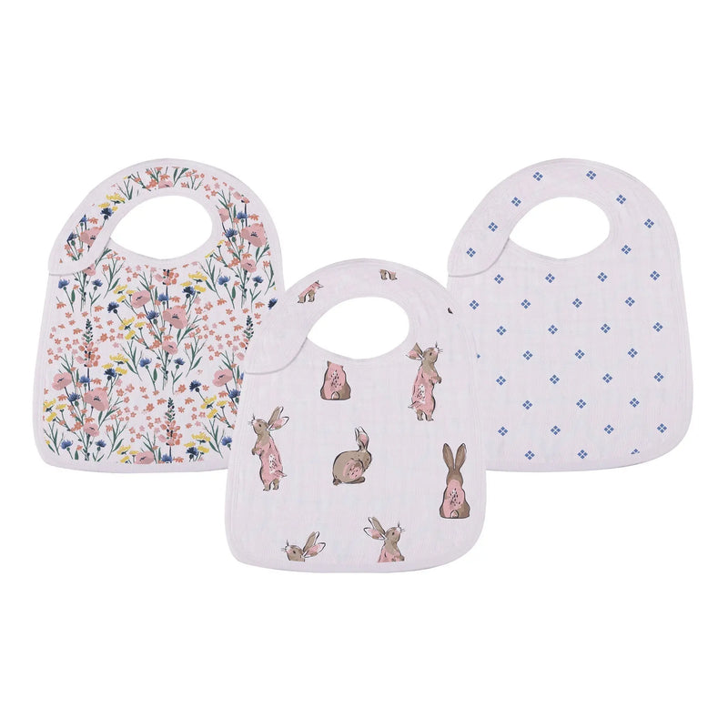 Set of three Wildflowers Snap Bibs made from 100% natural bamboo muslin with playful patterns, featuring three front snaps for an adjustable fit, perfect for feeding and teething.