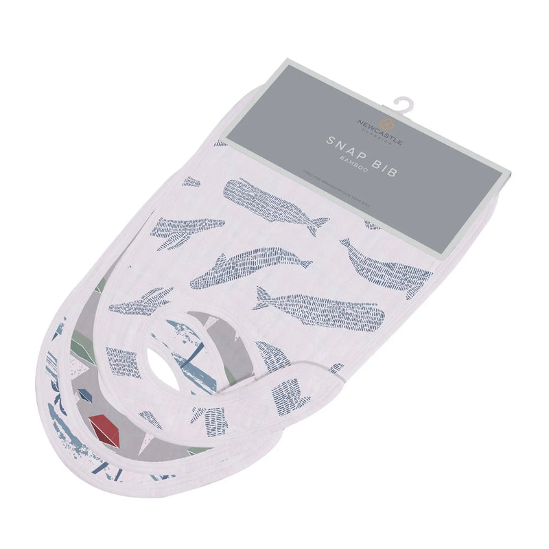 Soft Ocean Tides Bamboo Snap Bibs with whale pattern, made from 100% natural bamboo muslin, featuring three front snaps for adjustable fit.