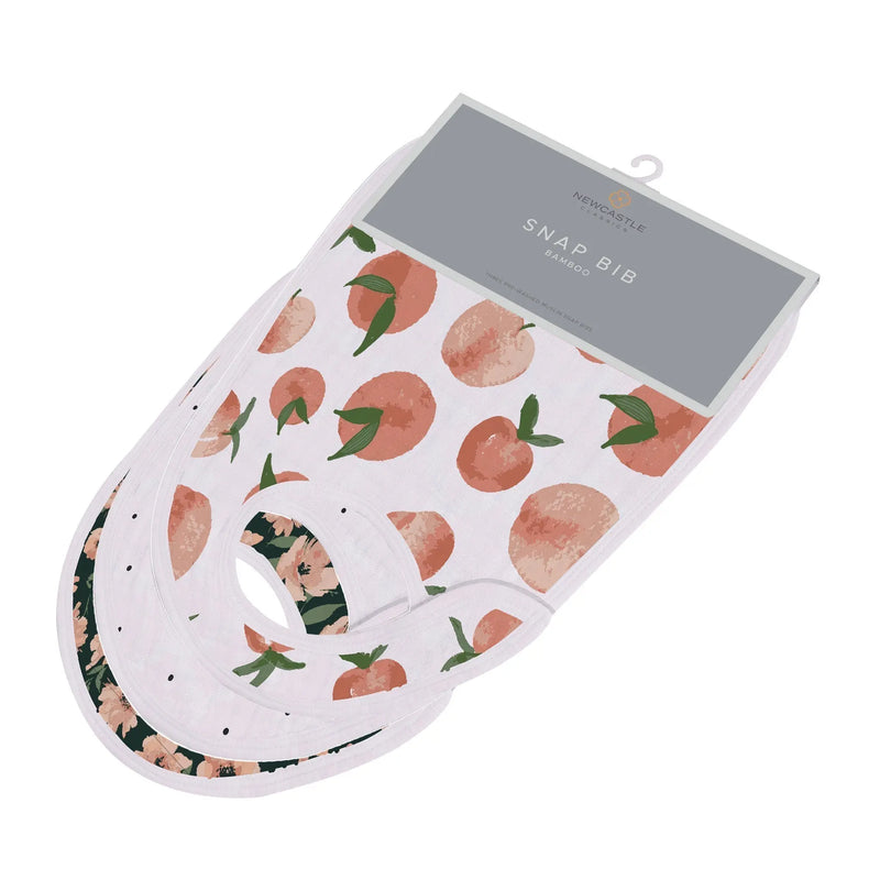 Canyon Sunset Bamboo Snap Bibs 3-pack with peach and floral prints made of soft bamboo muslin.