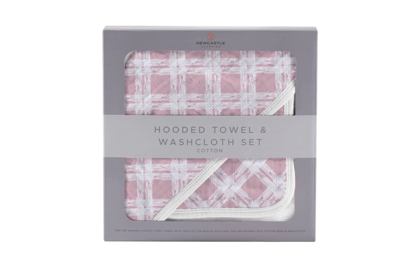Pink plaid cotton hooded towel and washcloth set in packaging.