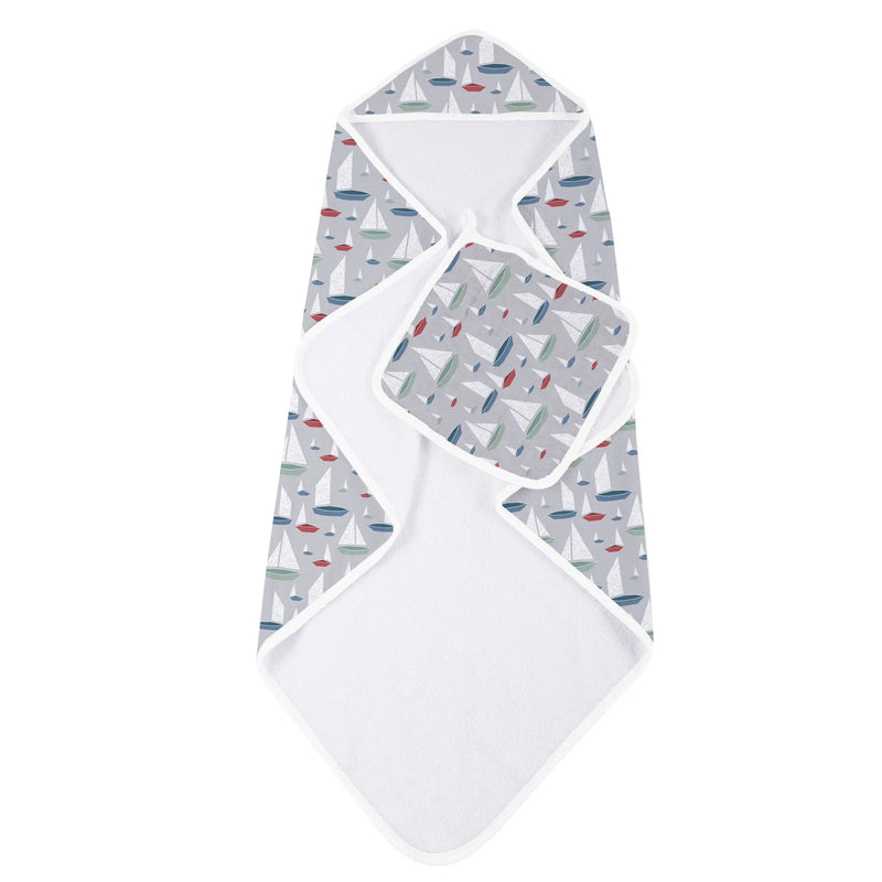 Bamboo hooded towel and washcloth set with sailboat pattern.