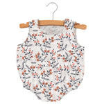 Sleeveless baby bubble one-piece in pink and white dahlia floral print with snaps at the neckline