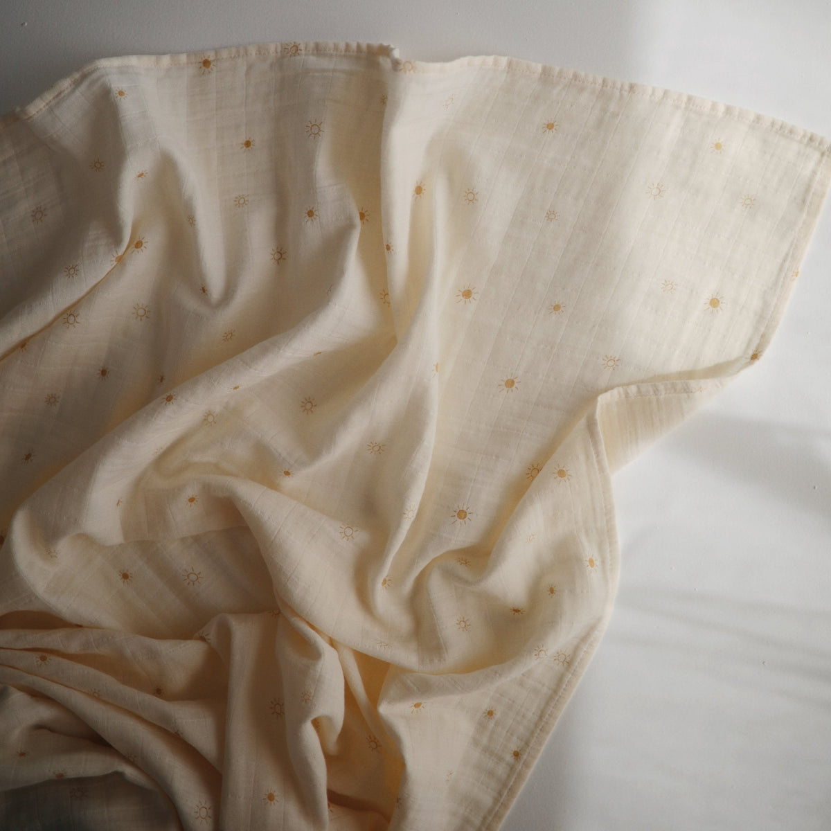 Mushie organic cotton muslin swaddle blanket