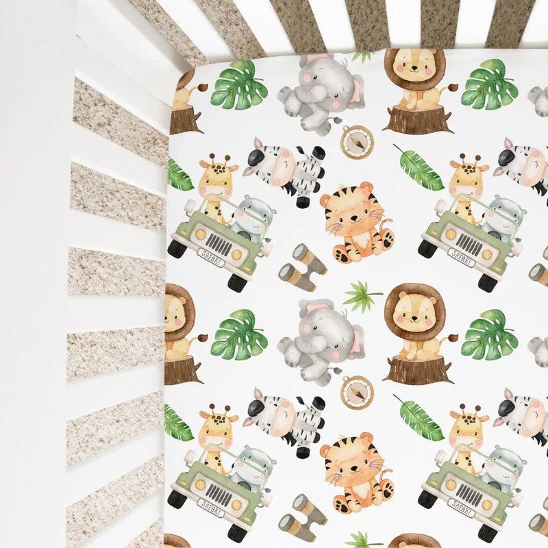 Safari-themed fitted crib sheet with animal prints, designed for standard-size cribs.