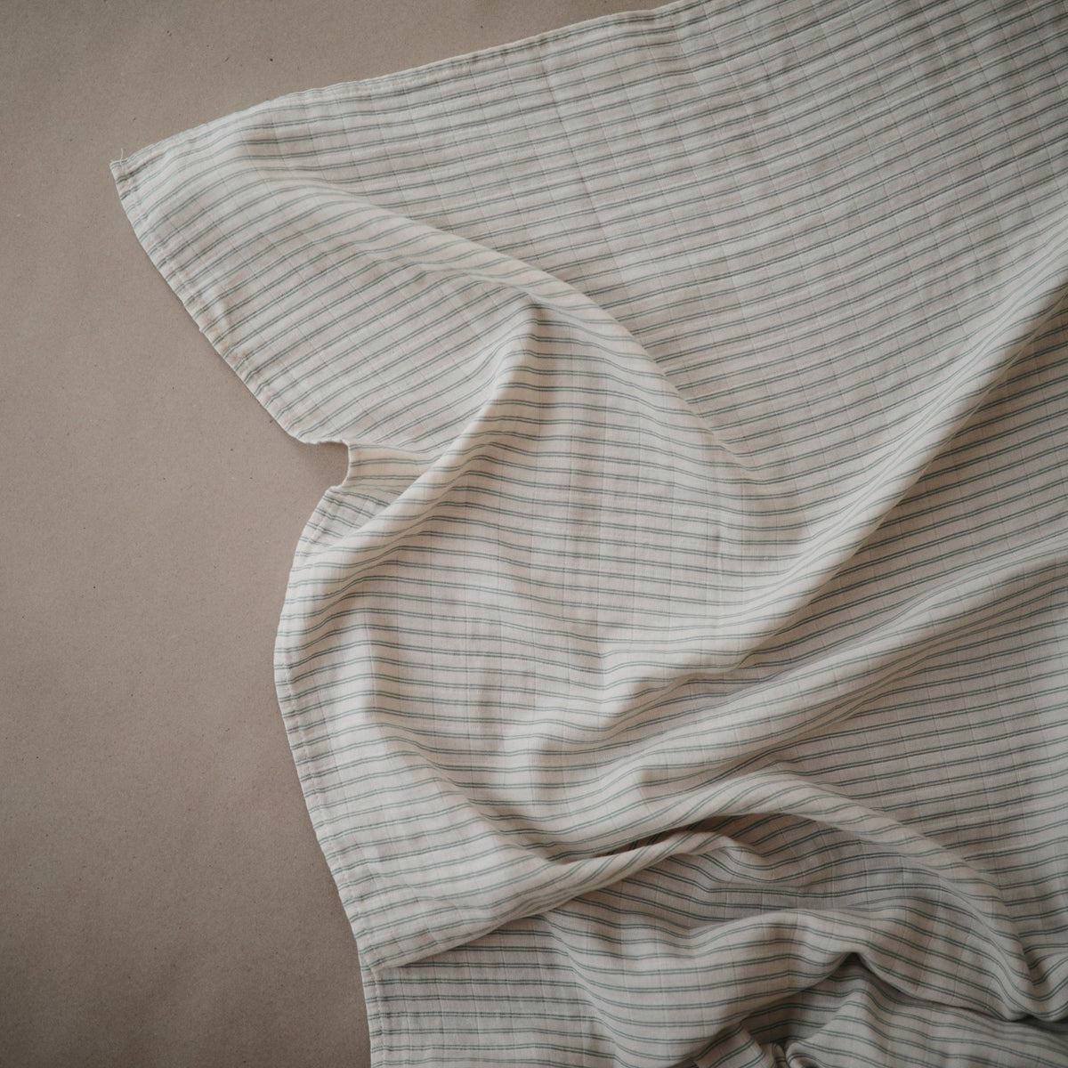 Mushie organic cotton muslin swaddle blanket