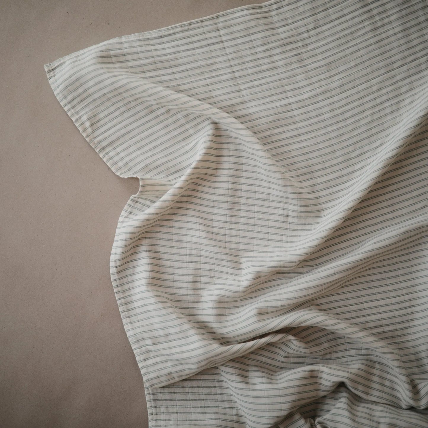 Organic Cotton Muslin Swaddle Blanket for Baby Cuddling and Nursing Mushie