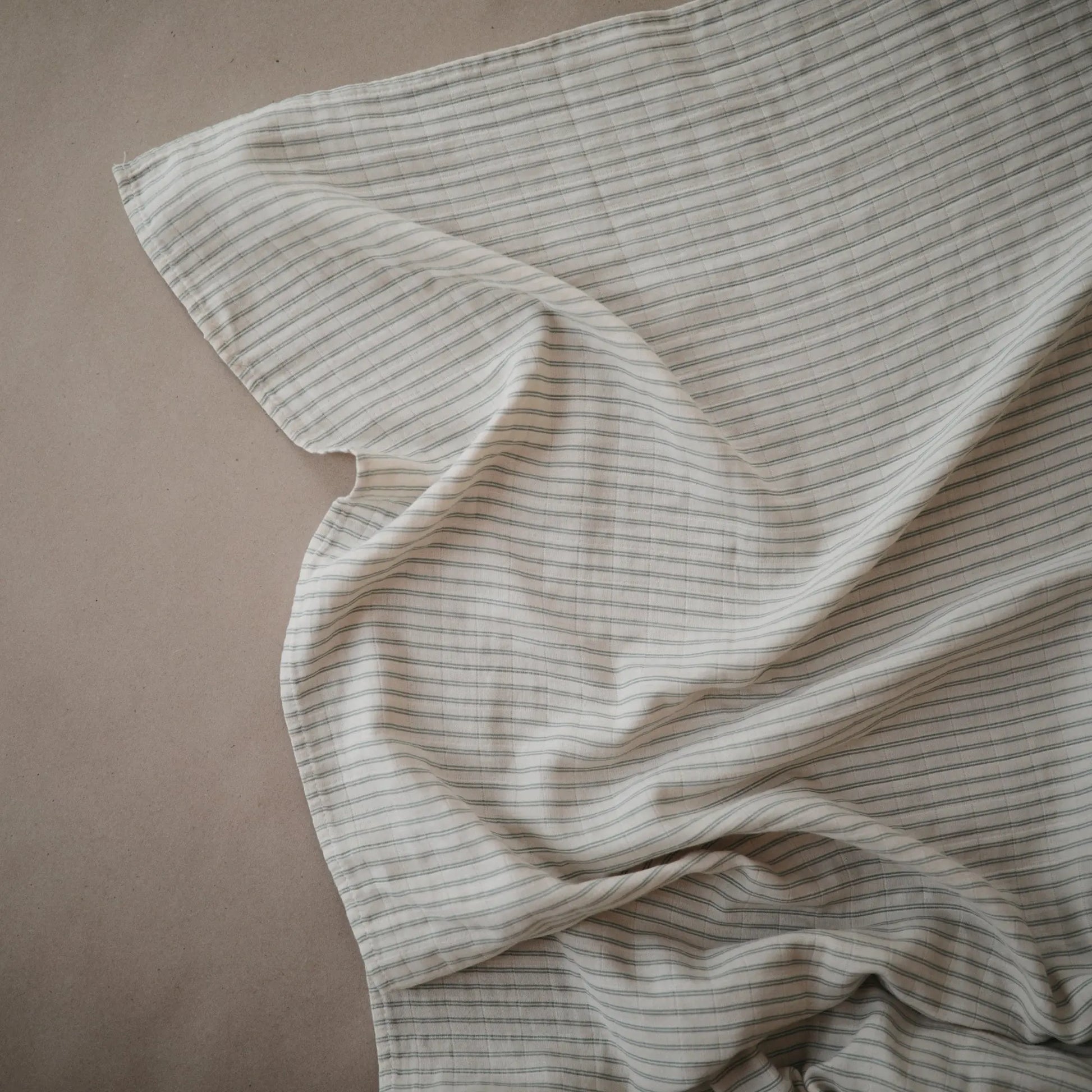 Organic Cotton Muslin Swaddle Blanket for Baby Cuddling and Nursing Mushie