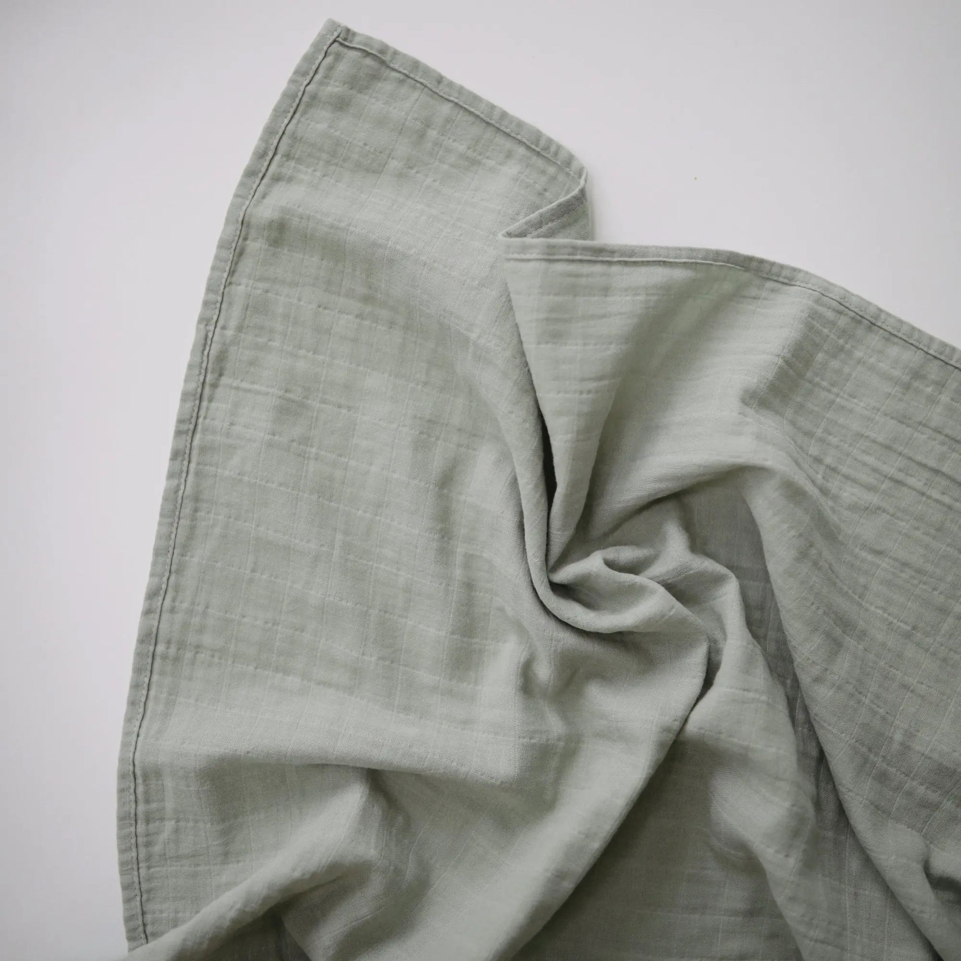 Organic Cotton Muslin Swaddle Blanket for Baby Cuddling and Nursing Mushie