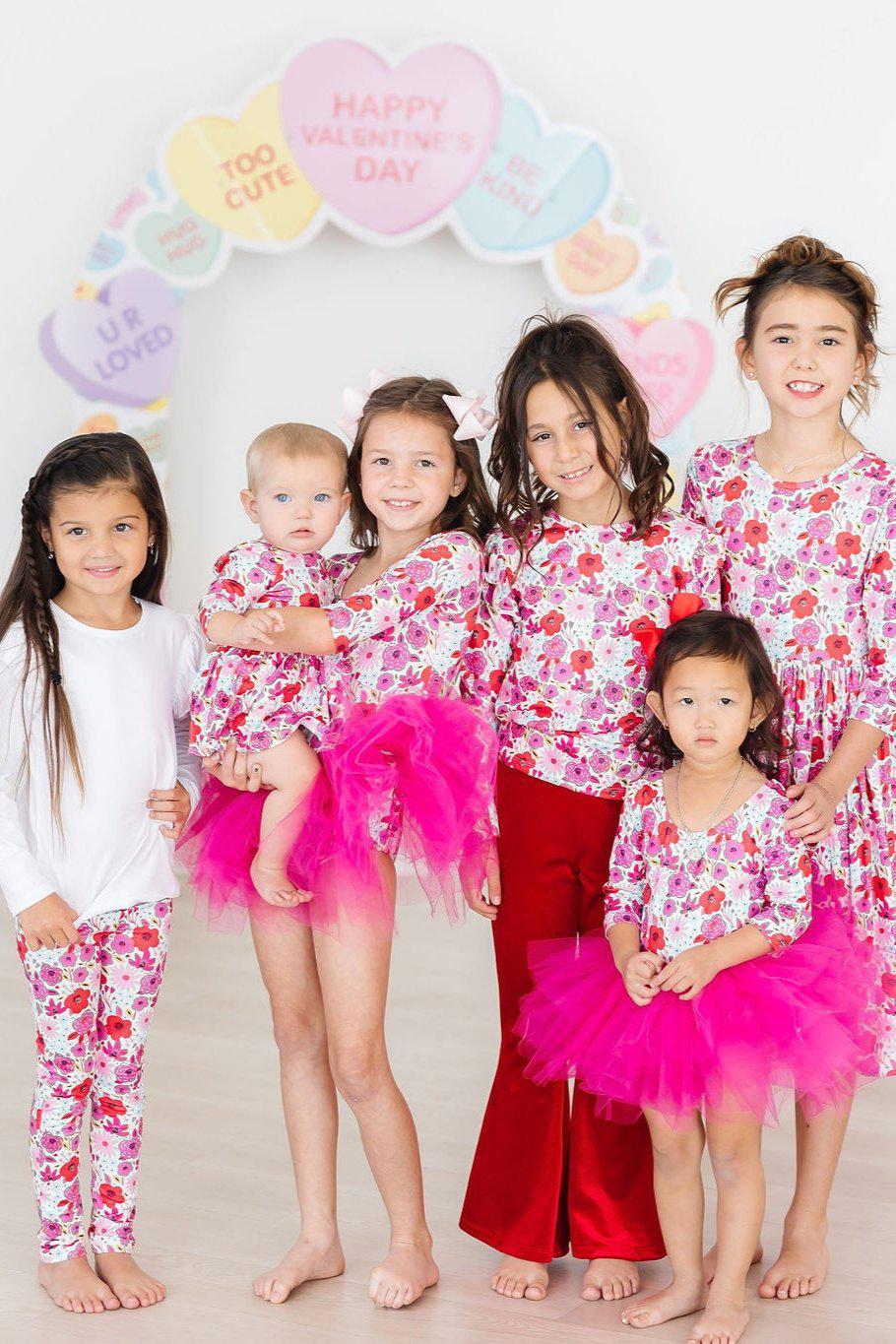 Mila & Rose Secret Garden organic baby leggings, colorful floral print.