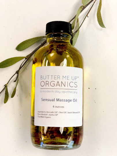 Organic Sensual Massage Oil bottle with natural ingredients like avocado, olive, and sweet almond oils, scented with rose absolut, by Butter Me Up Organics.